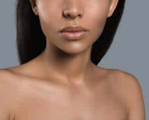 Close-up image of a woman’s full lips after lip filler treatment.